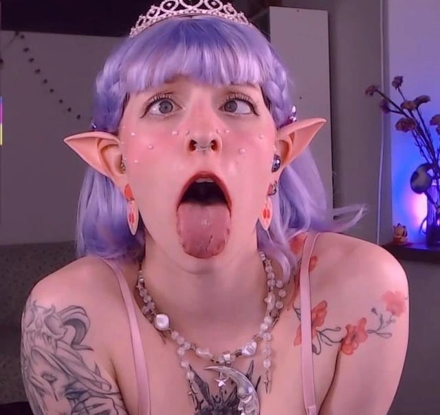 Tattooed alt girl rocking an intense ahegao porn look
